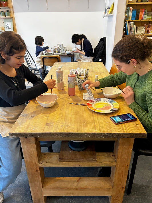 two girls pottery painting